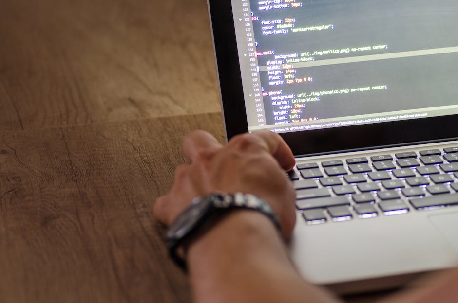 Two individuals wearing white gloves are holding young, healthy green plants with visible roots in a garden or indoor planting space. The plants have lush foliage with small, bright green leaves, and 